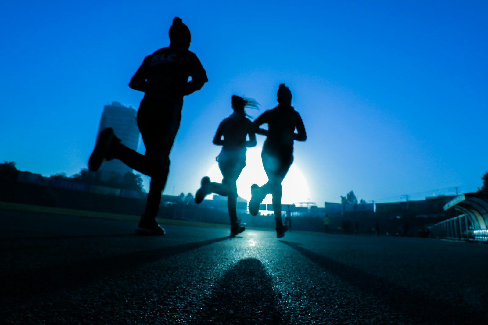 Runners moving together in the morning light